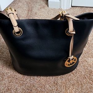 Michael Kors snap closure black leather bag, tan straps, gold accent